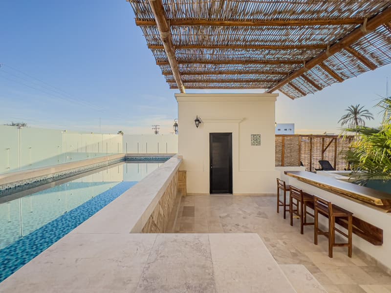Heated rooftop pool under the pergola