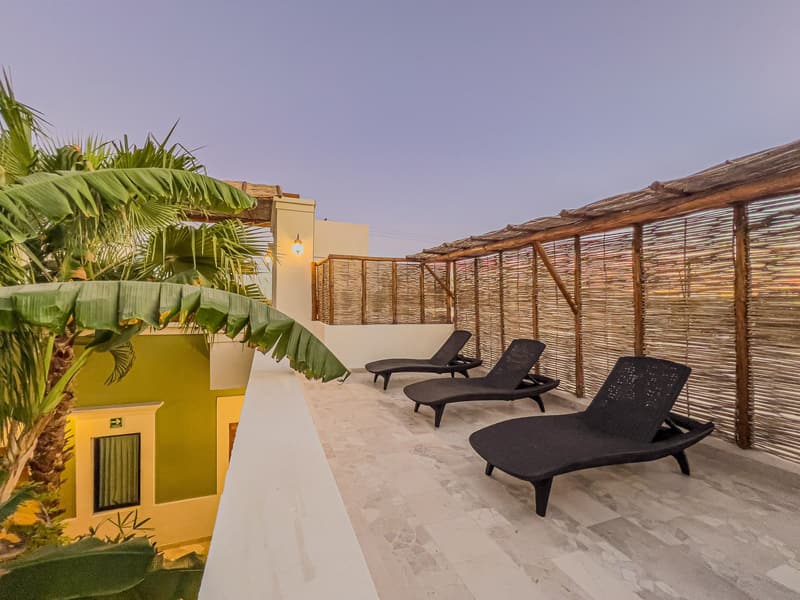 Sun deck with loungers beside the pool